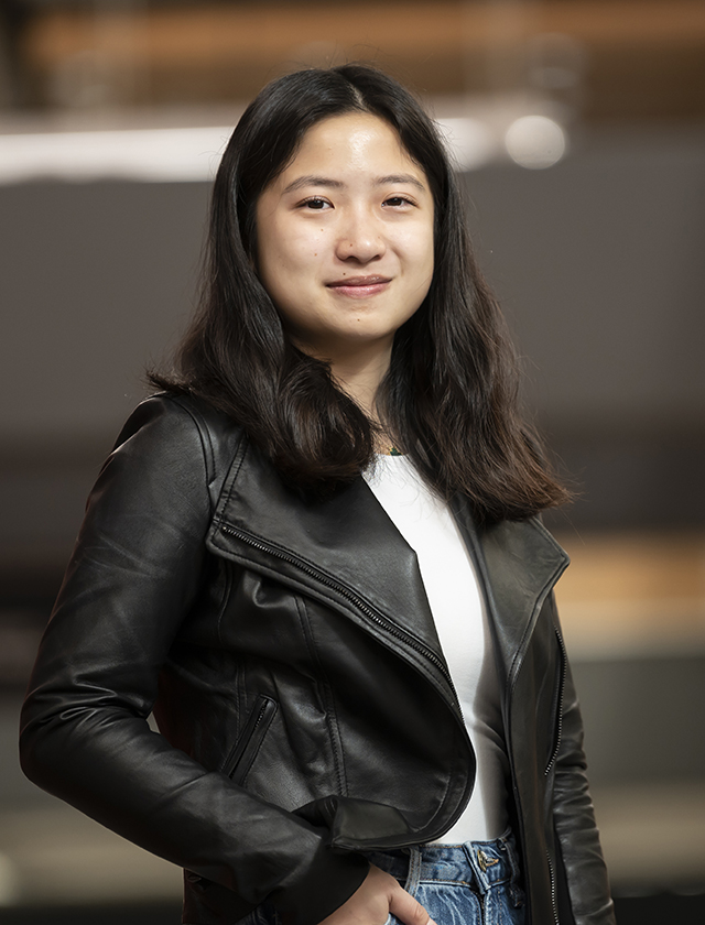 Isabel Lam in a white shirt and black leather jacket