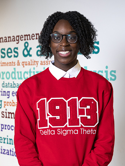 Anaya Joynes in a red Delta Signa Theta shirt