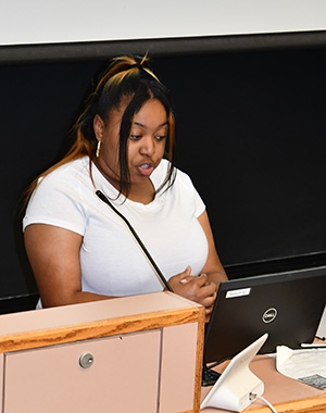 Johnson gives a presentation at a podium