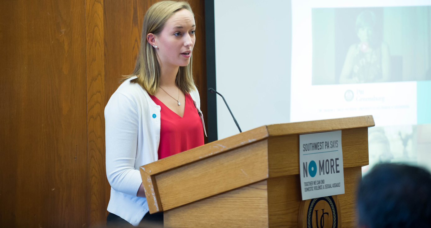 young woman with blond hair at a podium