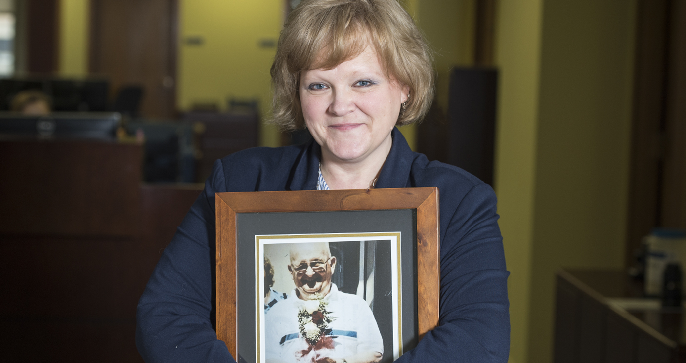 Wanda DiPaolo holds a photograph of her father