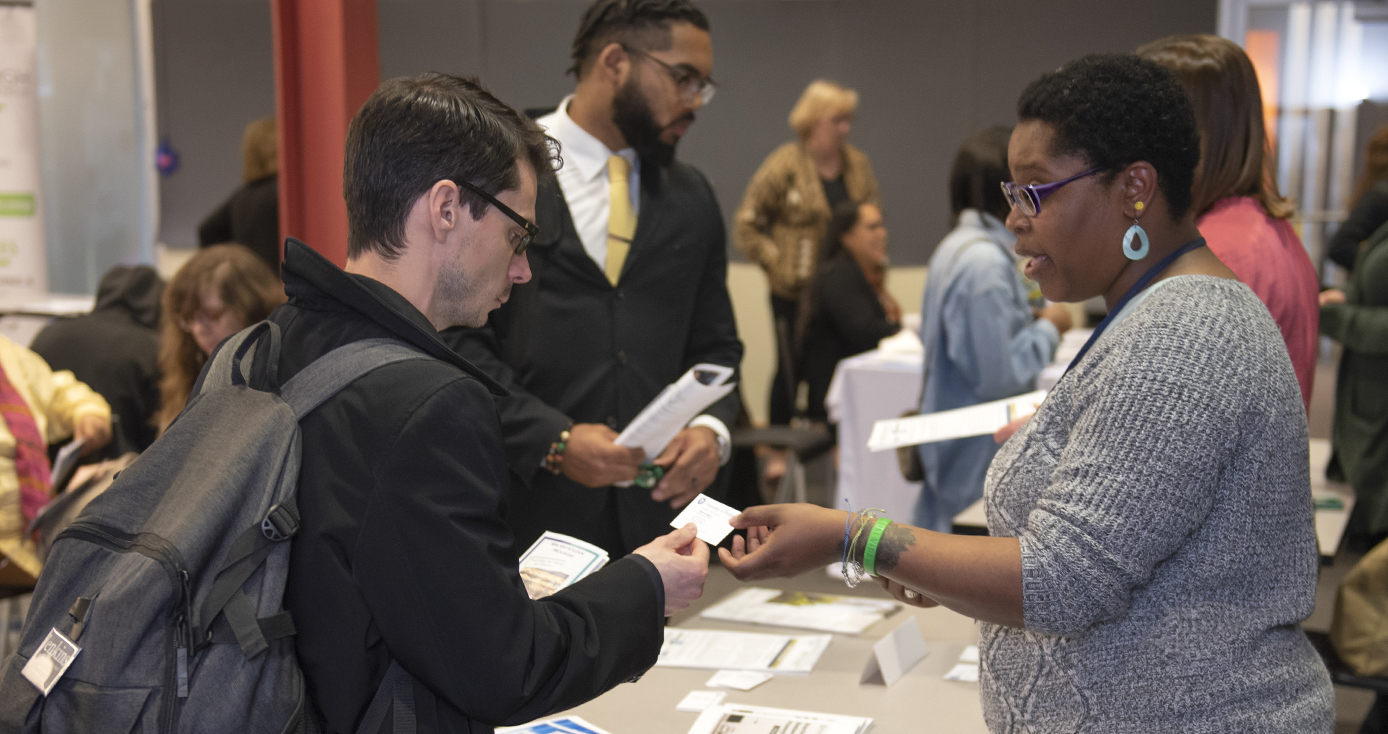 Local entrepreneur Jeremy Burnworth (left) accepts advice from LaMonica Wiggins on his plan for an incubator to help entrepreneurs who have a criminal background. Wiggins was staffing a table at a recent Small Business Resource Fair in Squirrel Hill. 