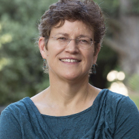 Farmer in a teal blouse