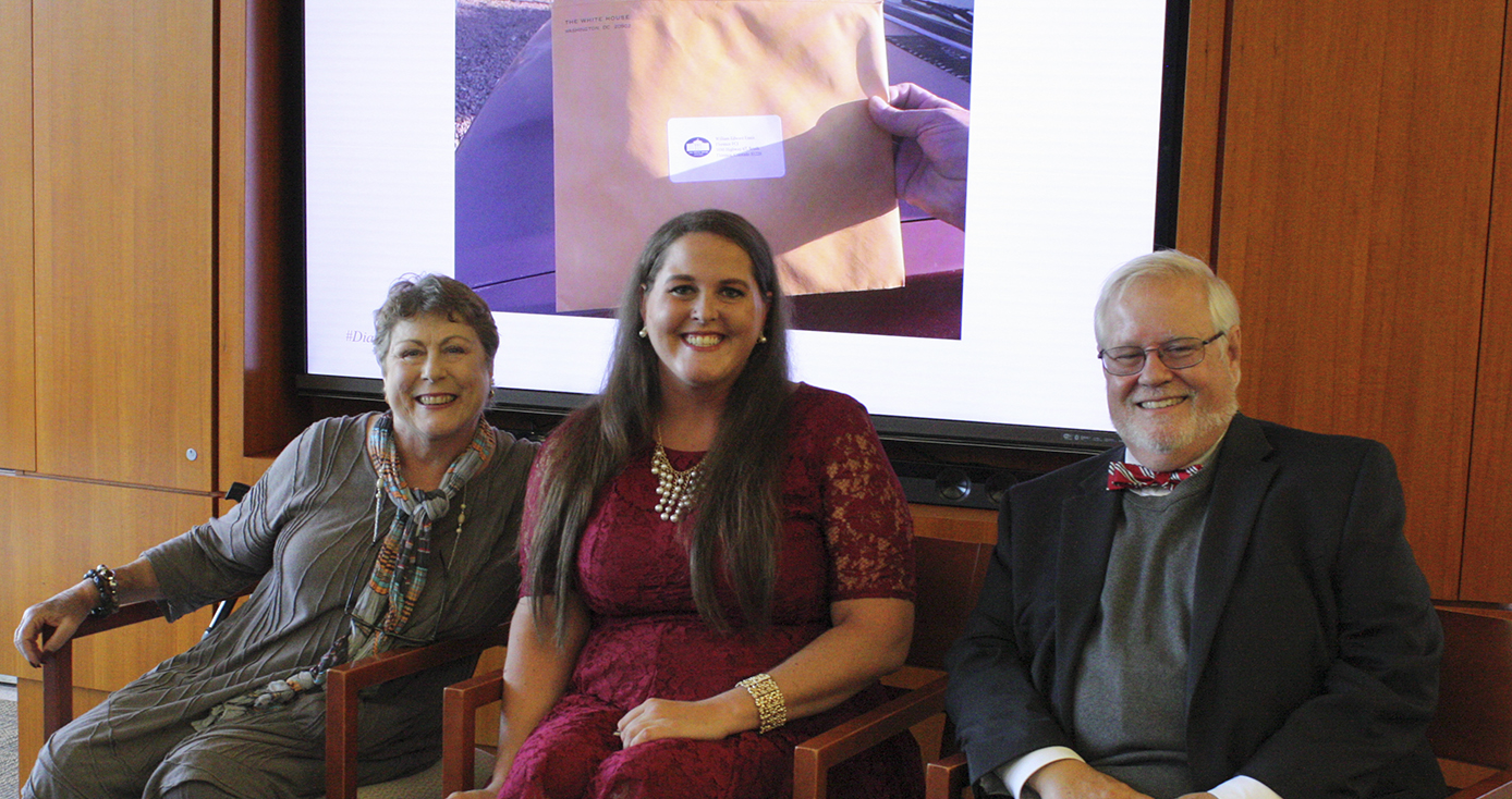 three people smiling