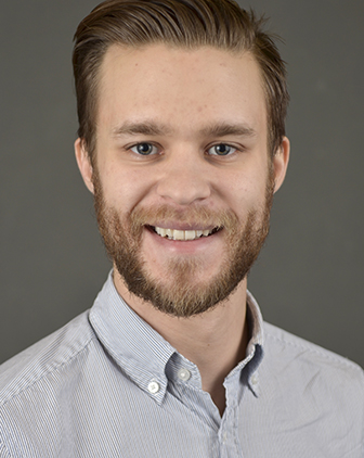 Rossi in front of a gray background