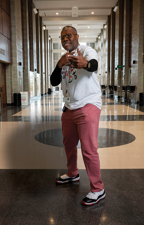 Herring strikes a poses in a school hallway