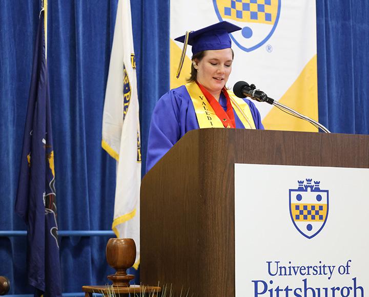 A student speaks at a podium