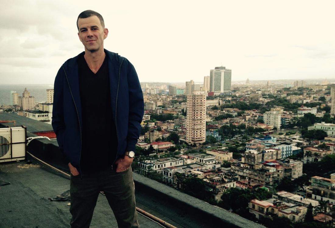 Horst stands on top of a building overlooking Havana