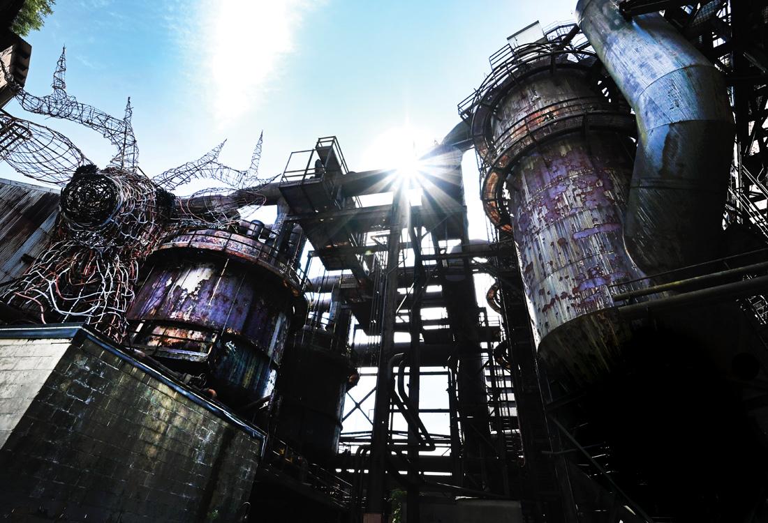 An industrial site set against a blue sky.