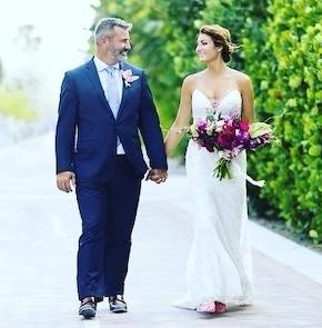 A bride and groom look at each other.