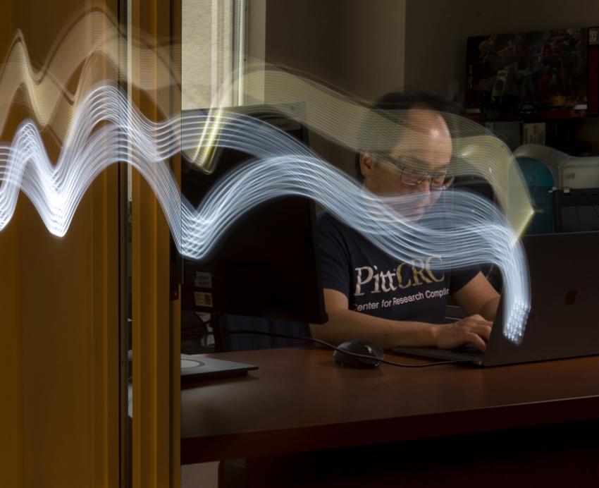 Kim Wong and Adam Hobaugh connected by waves of light