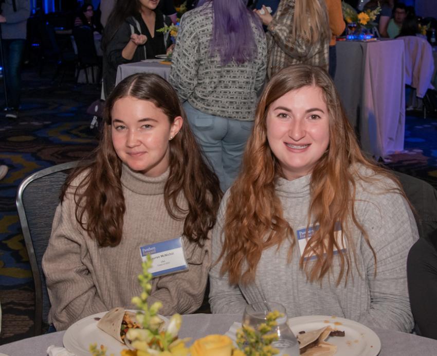 four students at a table