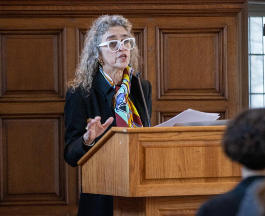 Laura Levitt speaking at a podium