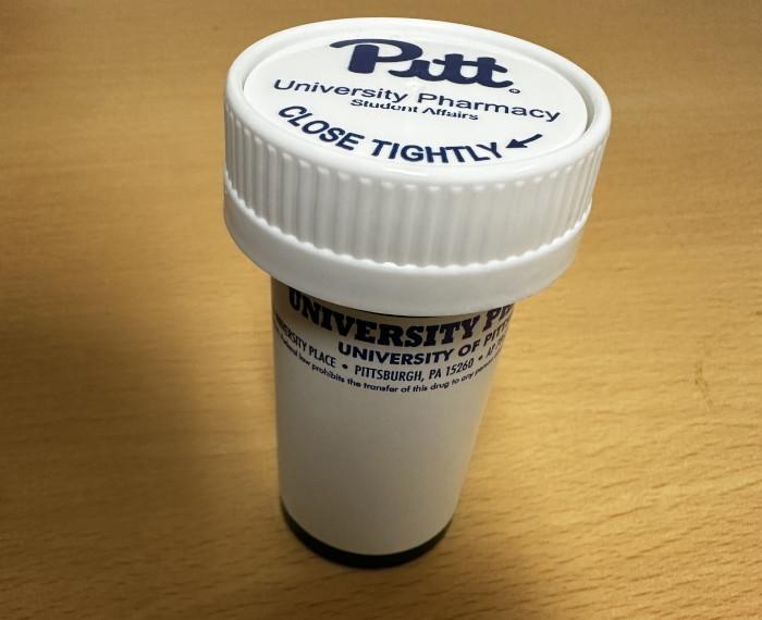 A Pitt-branded prescription bottle